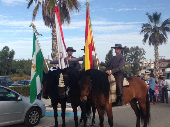 The three flag bearers, my neighbour on the left with the flag of Andalucía