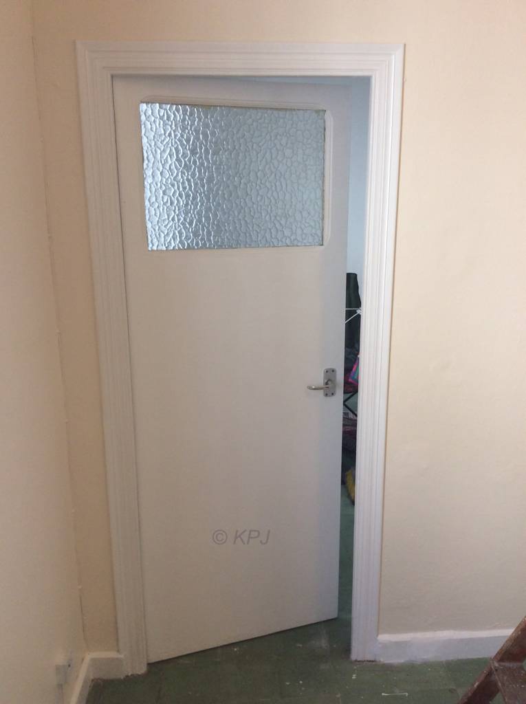 This door was blocked up with a crazy panel, it also meant there was no fire exit route from the kitchen. Freed it up and added handles.